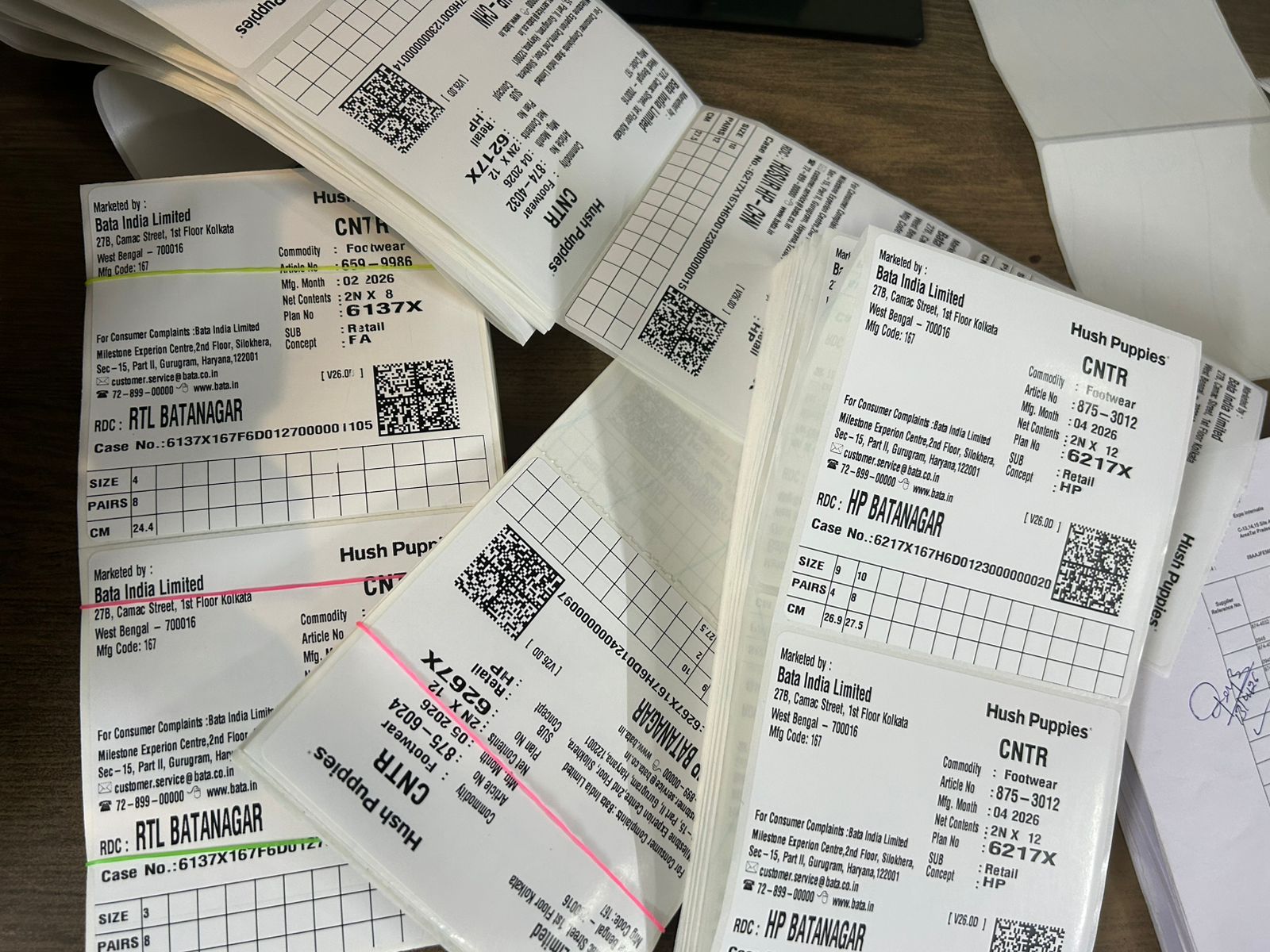 Printed carton labels carrying article, size and case numbers for a footwear order