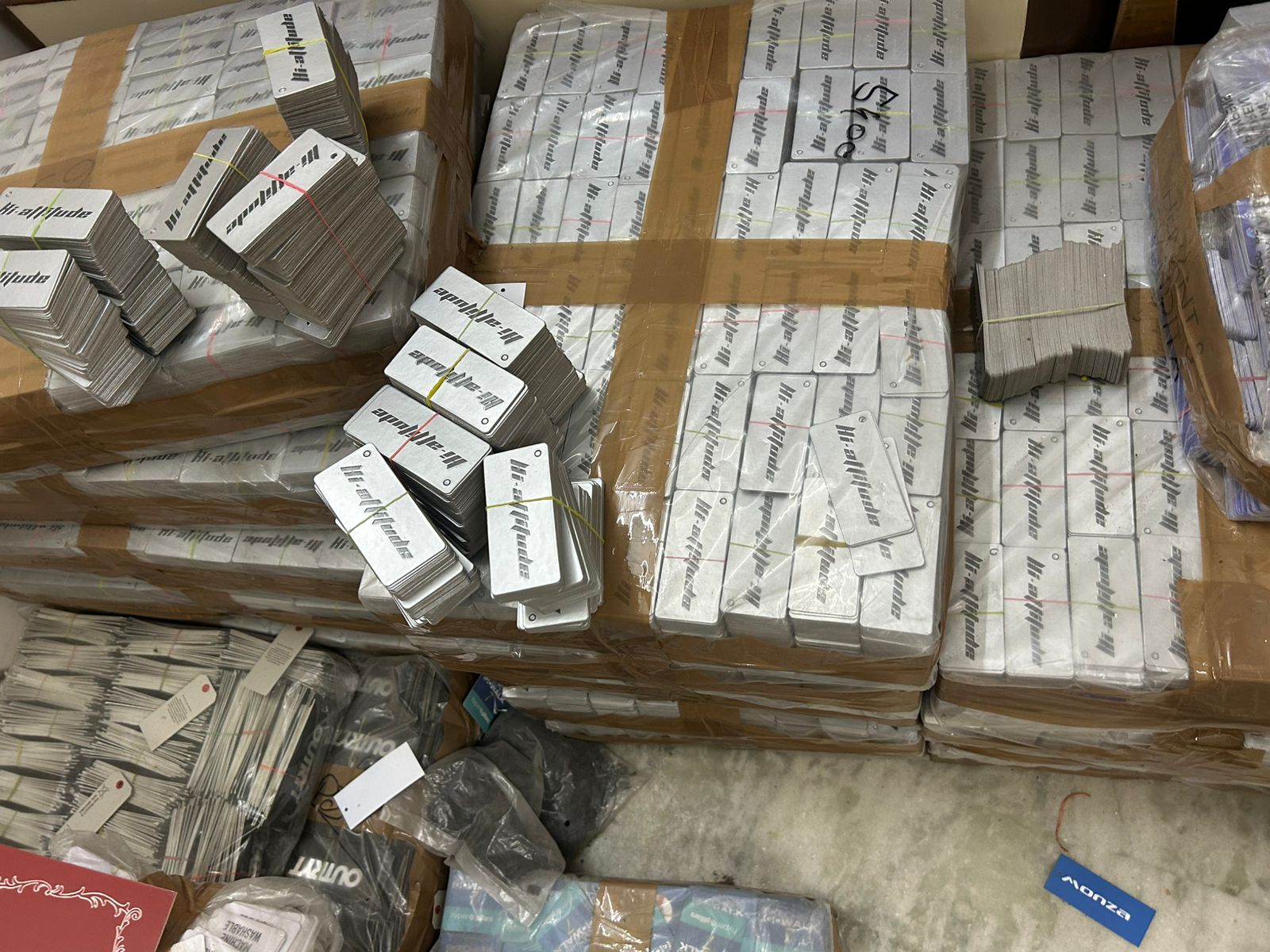 Printed hang tags banded into bundles and boxed as one coordinated order